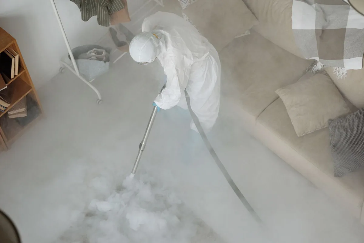 Biohazard cleanup technician in protective equipment, Grayson, KY
